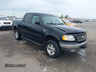 2002 Ford F-150 XLT with VIN 1FTRW08L32KD90202, listed as a IAAI auction lot 41850546 with 256,807 mi miles. Bid and sale history available at carsss.com. Image 1.