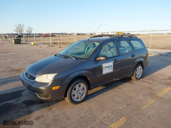 2006 Ford Focus SE with VIN 1FAHP36N16W228667, listed as a IAAI auction lot 41965634 with 141,460 mi miles. Bid and sale history available at carsss.com. Image 2.