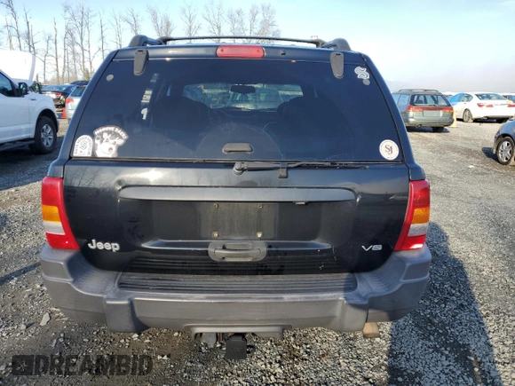 1999 Jeep Grand Cherokee Laredo z VIN 1J4GW58N1XC737706, wystawiony jako Copart lot #83107914 z przebiegiem Nie podano mil oraz Szkoda całkowita • Salvage title. Historia ofert i sprzedaży dostępna na DreamBid. Obrazek 6.