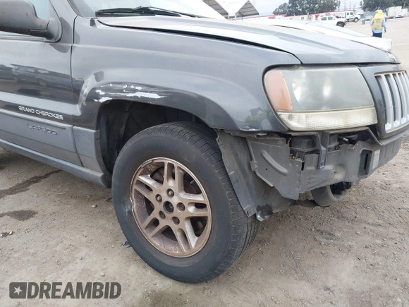 2004 Jeep Grand Cherokee Laredo with VIN 1J4GX48S34C214485, listed as a IAAI auction lot 42208120 with 164,322 mi miles and . Bid and sale history available at DreamBid. Image 12.