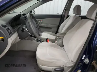 2009 Kia Spectra EX with VIN KNAFE221X95626293, listed as a Copart auction lot 70646504 with 197,017 mi miles and Clean Title. Bid and sale history available at carsss.com. Image 7.