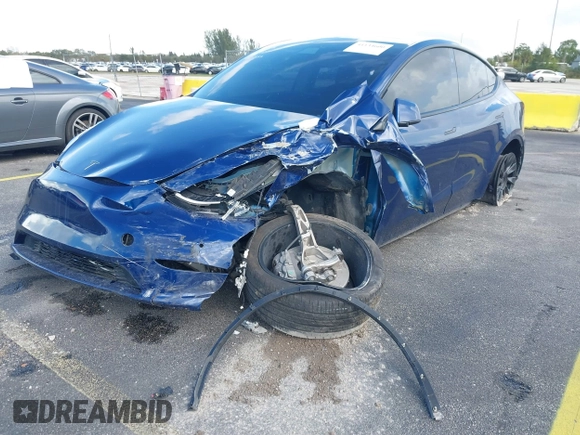 2021 Tesla Model Y Standard Range with VIN 5YJYGDED4MF112857, listed as a IAAI auction lot 41134600 with Not Provided miles and . Bid and sale history available at DreamBid. Image 6.