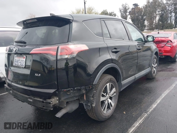 2018 Toyota RAV4 XLE with VIN 2T3WFREV3JW516867, listed as a IAAI auction lot 41765369 with 54,390 mi miles. Bid and sale history available at carsss.com. Image 4.