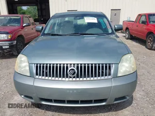 2006 Mercury Montego Luxury z VIN 1MEFM40106G609778, wystawiony jako IAAI lot #42212020 z przebiegiem Nie podano mil oraz . Historia ofert i sprzedaży dostępna na DreamBid. Obrazek 6.