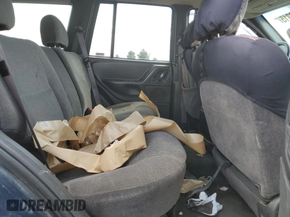 2000 Jeep Grand Cherokee Laredo z VIN 1J4GW48S2YC154627, wystawiony jako Copart lot #54173315 z przebiegiem 251 666 mil mil oraz Szkoda całkowita • Salvage title. Historia ofert i sprzedaży dostępna na DreamBid. Obrazek 11.