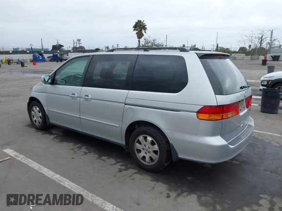 2003 Honda Odyssey EX-L with VIN 5FNRL18943B030373, listed as a IAAI auction lot 41867289 with 179,718 mi miles and . Bid and sale history available at DreamBid. Image 3.