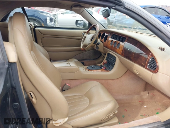 1997 Jaguar XK with VIN SAJGX274XVC017622, listed as a IAAI auction lot 41614339 with 94,298 mi miles and . Bid and sale history available at DreamBid. Image 5.