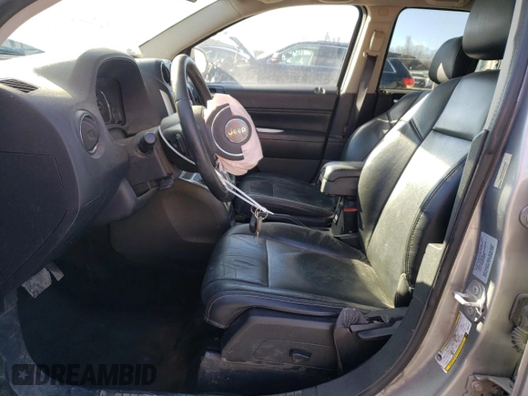2016 Jeep Compass Latitude with VIN 1C4NJDEB2GD697923, listed as a Copart auction lot 84081394 with 167,240 mi miles and Salvage Title. Bid and sale history available at carsss.com. Image 7.