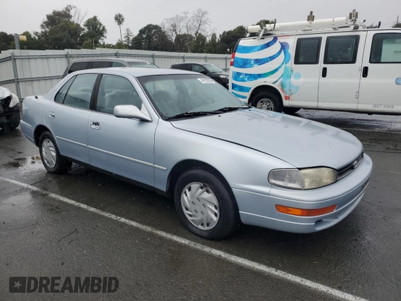 1994 Toyota Camry LE with VIN 4T1SK12E8RU411682, listed as a Copart auction lot 44153535 with 214,022 mi miles and Salvage Title. Bid and sale history available at carsss.com. Image 4.
