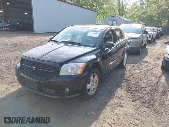 2007 Dodge Caliber SXT with VIN 1B3HB48B57D159305, listed as a IAAI auction lot 42095938 with 120,684 mi miles and . Bid and sale history available at DreamBid. Image 2.
