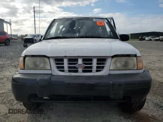 1999 Kia Sportage with VIN KNDJA7233X5600719, listed as a Copart auction lot 80529384 with 56,657 mi miles and Salvage Title. Bid and sale history available at carsss.com. Image 5.