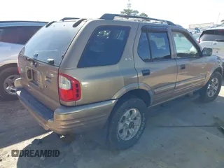 2001 Isuzu Rodeo S with VIN 4S2CK58W414322118, listed as a IAAI auction lot 41496624 with 244,189 mi miles and . Bid and sale history available at DreamBid. Image 4.