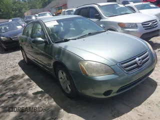 2002 Nissan Altima S z VIN 1N4AL11D02C147963, wystawiony jako IAAI lot #42318252 z przebiegiem 203 894 mil mil oraz . Historia ofert i sprzedaży dostępna na DreamBid. Obrazek 1.