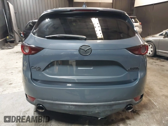 2021 Mazda CX-5 Touring with VIN JM3KFBCM5M0365725, listed as a IAAI auction lot 41411763 with 77,504 mi miles. Bid and sale history available at carsss.com. Image 17.