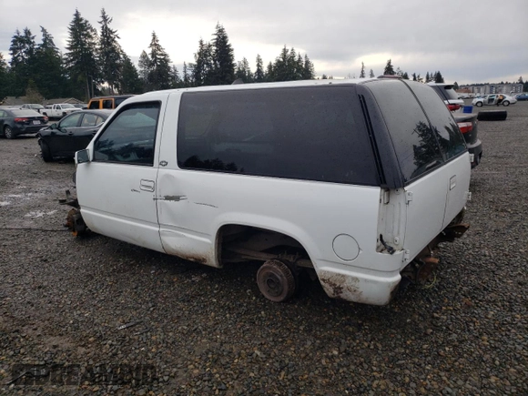 1997 Chevrolet Tahoe z VIN 3GNEC18R7VG122449, wystawiony jako Copart lot #85718304 z przebiegiem Nie podano mil oraz Szkoda całkowita • Salvage title. Historia ofert i sprzedaży dostępna na DreamBid. Obrazek 2.