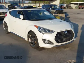 2014 Hyundai Veloster Turbo with VIN KMHTC6AE9EU201750, listed as a IAAI auction lot 40691529 with 87,958 mi miles and . Bid and sale history available at DreamBid. Image 1.
