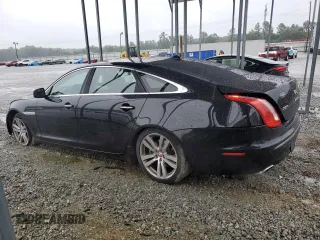 2014 Jaguar XJ Portfolio with VIN SAJWJ2GD5E8V69982, listed as a Copart auction lot 58933515 with 92,847 mi miles and Salvage title. Bid and sale history available at DreamBid. Image 2.