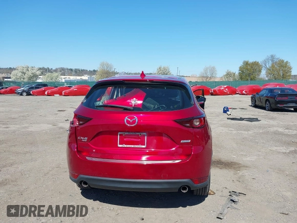2019 Mazda CX-5 Sport with VIN JM3KFBBM6K1596402, listed as a IAAI auction lot 41971766 with 60,396 mi miles and . Bid and sale history available at DreamBid. Image 17.