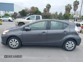 2014 Toyota Prius One with VIN JTDKDTB37E1564963, listed as a IAAI auction lot 42054591 with 186,680 mi miles and . Bid and sale history available at DreamBid. Image 14.