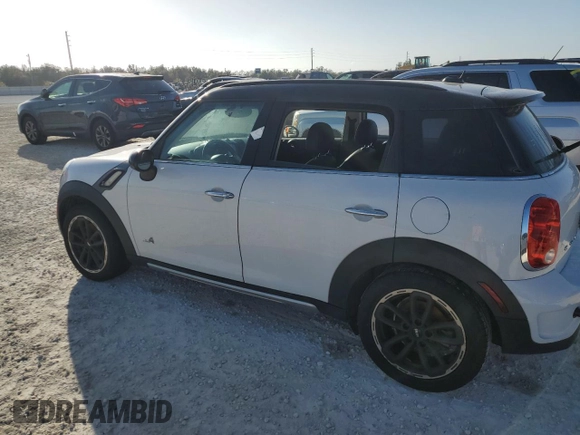 2016 MINI Countryman S with VIN WMWZC5C51GWU01290, listed as a Copart auction lot 77684384 with 106,811 mi miles and Salvage Title. Bid and sale history available at DreamBid. Image 2.