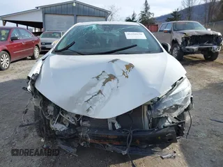 2017 Toyota Corolla L z VIN 5YFBURHE5HP633791, wystawiony jako IAAI lot #41426630 z przebiegiem 99 450 mil mil oraz . Historia ofert i sprzedaży dostępna na DreamBid. Obrazek 13.