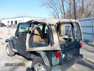 2001 Jeep Wrangler Sport with VIN 1J4FA49S31P317597, listed as a IAAI auction lot 41839524 with 145,164 mi miles. Bid and sale history available at carsss.com. Image 6.