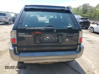2003 Isuzu Rodeo z VIN 4S2CK58W734311374, wystawiony jako Copart lot #57949325 z przebiegiem 247 580 mil mil oraz Tytuł czysty. Historia ofert i sprzedaży dostępna na DreamBid. Obrazek 6.