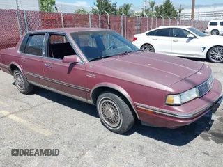 1988 Oldsmobile Cutlass Ciera with VIN 2G3AM5132J9375426, listed as a IAAI auction lot 42014990 with 292,060 mi miles and . Bid and sale history available at DreamBid. Image 1.