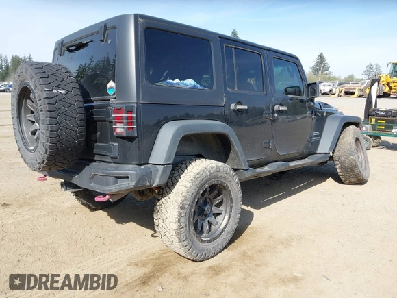 2015 Jeep Wrangler Unlimited Willys Wheeler with VIN 1C4BJWDG9FL750049, listed as a IAAI auction lot 42136188 with 115,328 mi miles and . Bid and sale history available at DreamBid. Image 4.