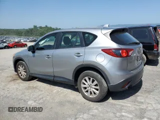 2014 Mazda CX-5 Sport with VIN JM3KE2BE7E0334880, listed as a Copart auction lot 61780635 with 96,926 mi miles and Salvage title. Bid and sale history available at DreamBid. Image 2.