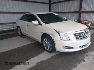 2014 Cadillac XTS Luxury with VIN 2G61M5S31E9210460, listed as a IAAI auction lot 41602087 with 1 mi miles. Bid and sale history available at carsss.com. Image 1.