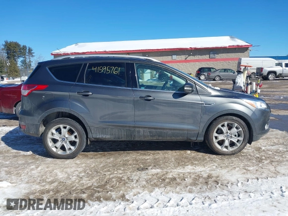 2015 Ford Escape Titanium with VIN 1FMCU9JX6FUB86304, listed as a IAAI auction lot 41595761 with 104,317 mi miles and . Bid and sale history available at DreamBid. Image 13.