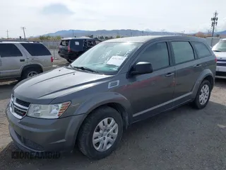 2013 Dodge Journey SE with VIN 3C4PDCAB7DT675440, listed as a IAAI auction lot 41927853 with 263,264 mi miles. Bid and sale history available at carsss.com. Image 2.