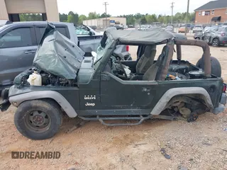 2004 Jeep Wrangler X z VIN 1J4FA39S84P714902, wystawiony jako IAAI lot #42011039 z przebiegiem Nie podano mil oraz . Historia ofert i sprzedaży dostępna na DreamBid. Obrazek 13.