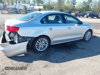 2014 Volkswagen Jetta TDI w/Premium with VIN 3VWLL7AJ2EM359341, listed as a IAAI auction lot 42030959 with 74,273 mi miles and . Bid and sale history available at DreamBid. Image 4.