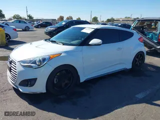 2014 Hyundai Veloster Turbo with VIN KMHTC6AE5EU201714, listed as a IAAI auction lot 40671069 with 151,901 mi miles. Bid and sale history available at carsss.com. Image 2.