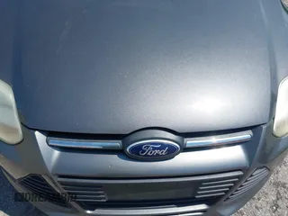 2013 Ford Focus SE with VIN 1FADP3F25DL337961, listed as a IAAI auction lot 42410460 with 143,446 mi miles and . Bid and sale history available at DreamBid. Image 6.
