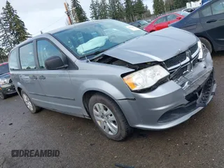 2014 Dodge Grand Caravan SE with VIN 2C4RDGBG7ER131079, listed as a IAAI auction lot 41614495 with 122,925 mi miles and . Bid and sale history available at DreamBid. Image 1.