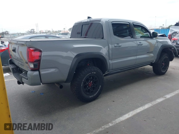 2021 Toyota Tacoma SR z VIN 5TFCZ5AN5MX281428, wystawiony jako IAAI lot #41893437 z przebiegiem 36 204 mil mil oraz . Historia ofert i sprzedaży dostępna na DreamBid. Obrazek 4.