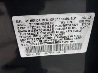 2012 Honda Pilot EX-L with VIN 5FNYF4H52CB068007, listed as a IAAI auction lot 42184390 with 137,126 mi miles and . Bid and sale history available at DreamBid. Image 9.