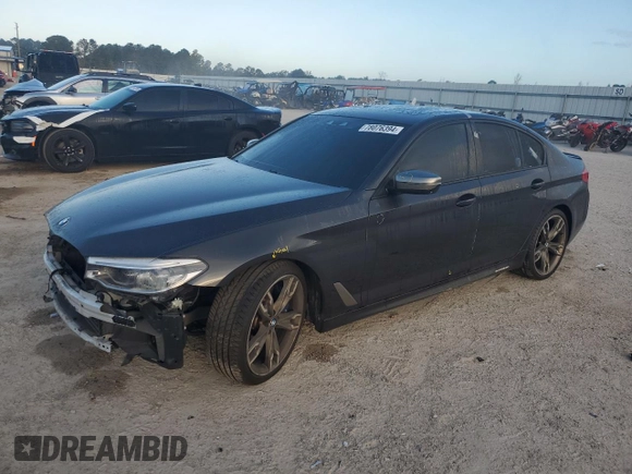 2019 BMW 5 Series M550i xDrive with VIN WBAJB9C57KB288906, listed as a Copart auction lot 79846274 with 61,744 mi miles and Salvage title. Bid and sale history available at DreamBid. Image 1.
