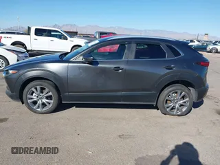 2022 Mazda CX-30 S Select z VIN 3MVDMBBL0NM415511, wystawiony jako IAAI lot #41513247 z przebiegiem Nie podano mil oraz . Historia ofert i sprzedaży dostępna na DreamBid. Obrazek 15.