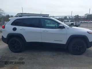 2014 Jeep Cherokee Trailhawk with VIN 1C4PJMBS5EW240375, listed as a IAAI auction lot 41806725 with 127,705 mi miles. Bid and sale history available at carsss.com. Image 13.