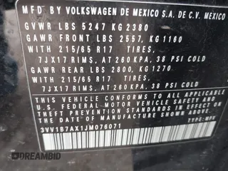 2018 Volkswagen Tiguan S with VIN 3VV1B7AX1JM076071, listed as a IAAI auction lot 42043311 with 107,883 mi miles and . Bid and sale history available at DreamBid. Image 9.