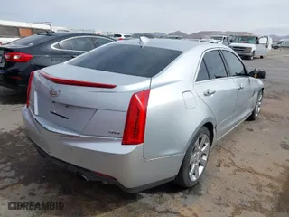 2015 Cadillac ATS Luxury with VIN 1G6AB5R35F0117304, listed as a IAAI auction lot 41523433 with 126,805 mi miles. Bid and sale history available at carsss.com. Image 4.