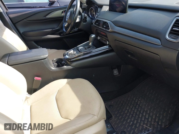 2021 Mazda CX-9 Touring with VIN JM3TCBCY7M0507699, listed as a IAAI auction lot 42603614 with 62,635 mi miles and . Bid and sale history available at DreamBid. Image 5.