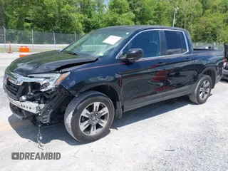 2017 Honda Ridgeline RTL with VIN 5FPYK3F51HB013989, listed as a IAAI auction lot 42206513 with 146,124 mi miles and . Bid and sale history available at DreamBid. Image 2.