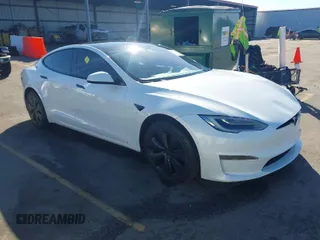 2021 Tesla Model S Long Range with VIN 5YJSA1E56MF453711, listed as a IAAI auction lot 41467603 with 115,634 mi miles and . Bid and sale history available at DreamBid. Image 1.