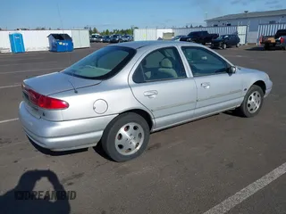 2000 Mercury Mystique z VIN 3MEFM6531YM604135, wystawiony jako IAAI lot #42148329 z przebiegiem 179 798 mil mil oraz . Historia ofert i sprzedaży dostępna na DreamBid. Obrazek 4.