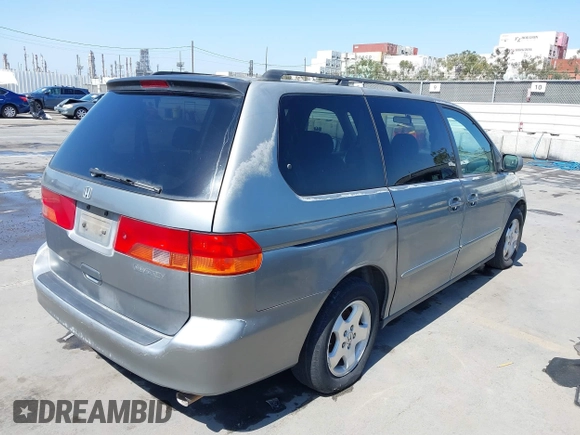 2001 Honda Odyssey EX z VIN 2HKRL18641H504729, wystawiony jako IAAI lot #42337944 z przebiegiem 203 356 mil mil oraz . Historia ofert i sprzedaży dostępna na DreamBid. Obrazek 4.